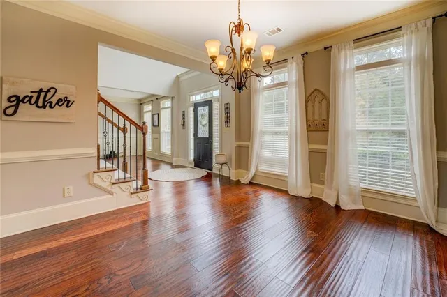 a living room with furniture and a ceiling fan