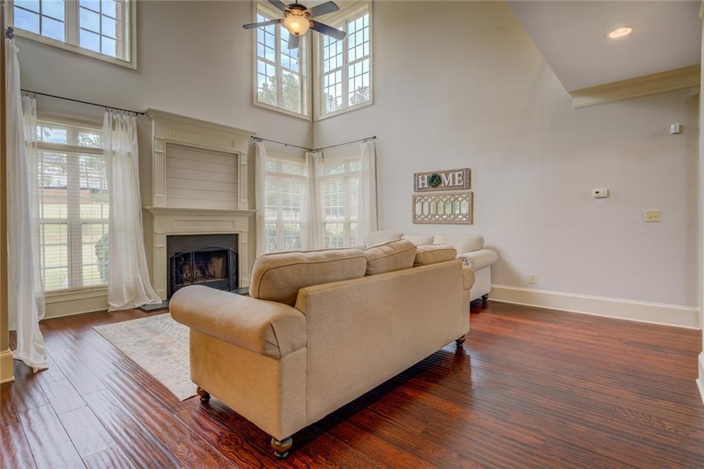 150 Alcovy Reserve Way Covington, GA 30014 - Photo 22 of 70 a living room with furniture and a fireplace