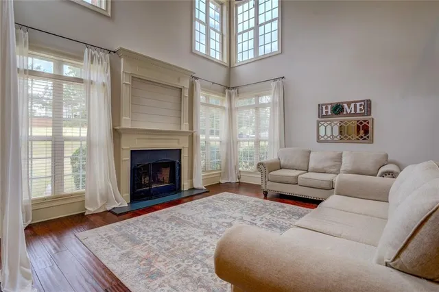 a kitchen with stainless steel appliances granite countertop wooden cabinets and a refrigerator