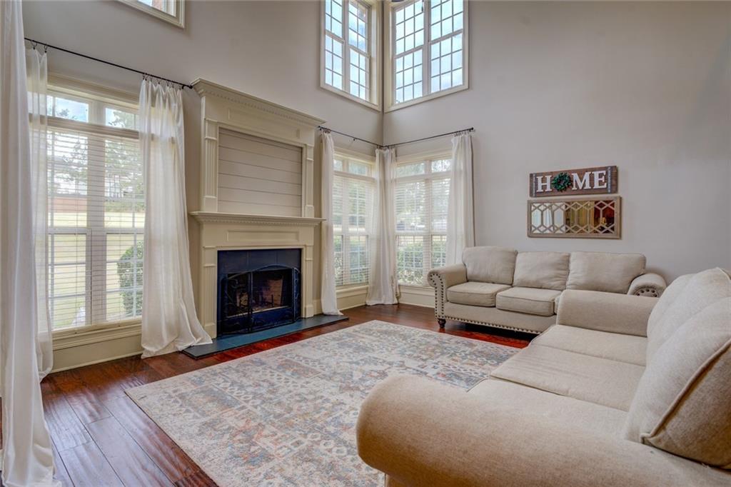 150 Alcovy Reserve Way Covington, GA 30014 - Photo 23 of 70 a living room with furniture and a fireplace