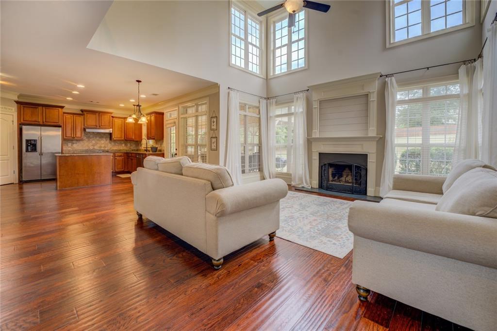 150 Alcovy Reserve Way Covington, GA 30014 - Photo 24 of 70 a living room with furniture and a fireplace