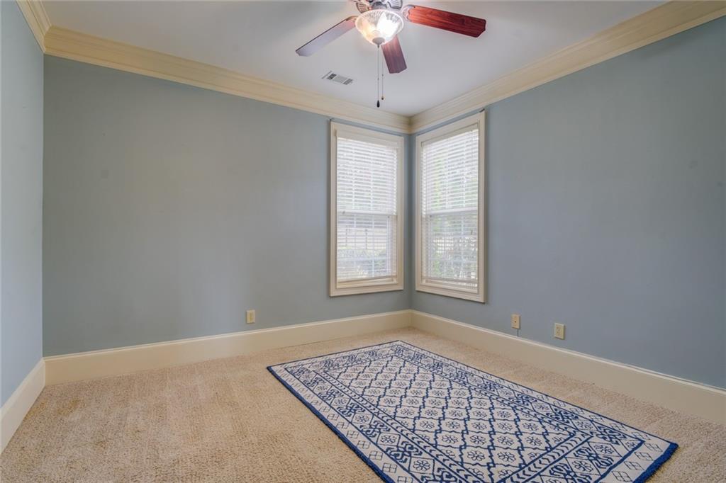 150 Alcovy Reserve Way Covington, GA 30014 - Photo 39 of 70 a view of an empty room with window and chandelier fan
