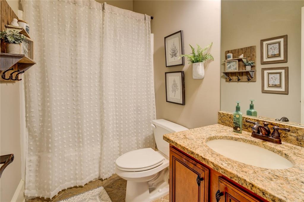 150 Alcovy Reserve Way Covington, GA 30014 - Photo 41 of 70 a bathroom with a granite countertop sink and a mirror