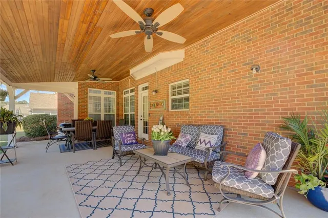 a view of a patio with couches and potted plants