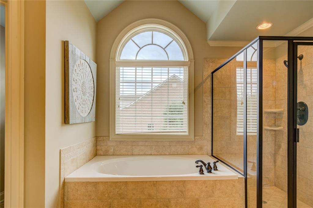 150 Alcovy Reserve Way Covington, GA 30014 - Photo 51 of 70 a bathroom with a bathtub and a window