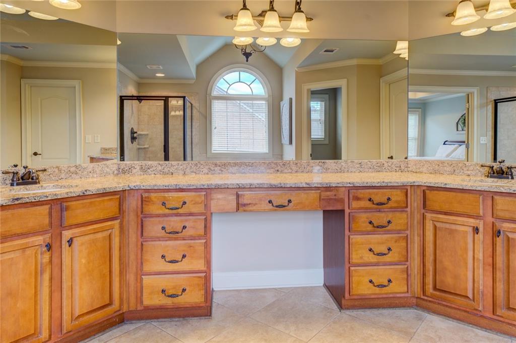 150 Alcovy Reserve Way Covington, GA 30014 - Photo 53 of 70 a bathroom with a granite countertop double vanity sink a mirror and a