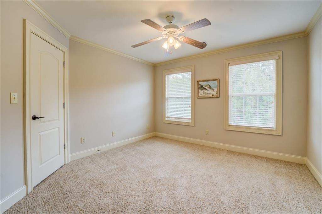 150 Alcovy Reserve Way Covington, GA 30014 - Photo 61 of 70 an empty room with windows and fan