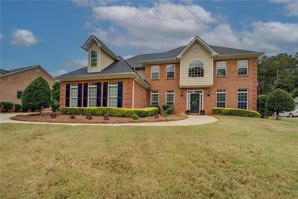 150 Alcovy Reserve Way Covington, GA 30014 - Photo 68 of 70 a front view of a house with a yard