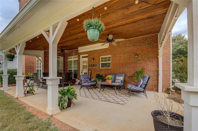 an aerial view of a house with yard swimming pool and outdoor seating
