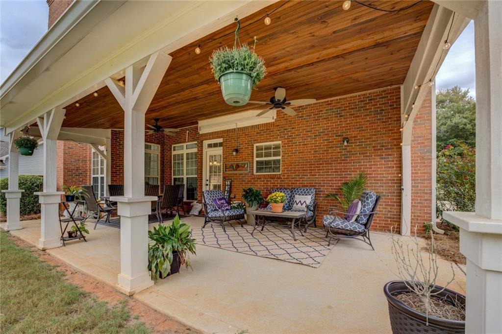 150 Alcovy Reserve Way Covington, GA 30014 - Photo 7 of 70 a view of a patio with couches and potted plants