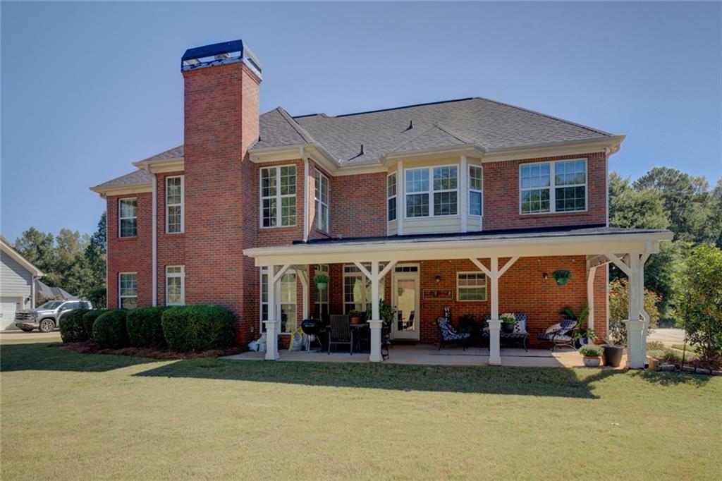 150 Alcovy Reserve Way Covington, GA 30014 - Photo 8 of 70 a front view of a house with garden
