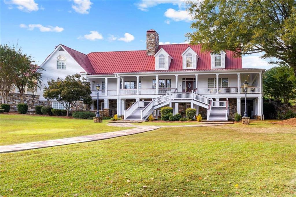 5225 Chalybeate Springs Road Woodland, GA 31836 - Photo 26 of 100 a front view of a house with swimming pool