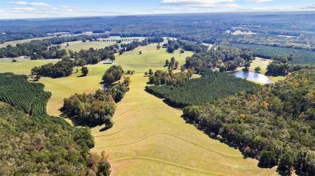 a view of a house with swimming pool and porch