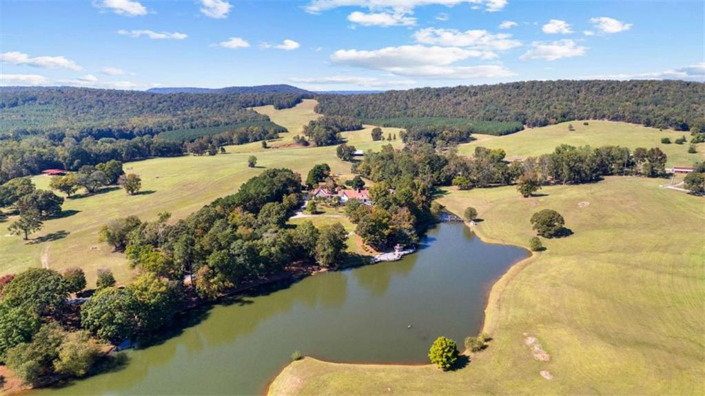 5225 Chalybeate Springs Road Woodland, GA 31836 - Photo 42 of 100 a view of a lake with a mountain in the background