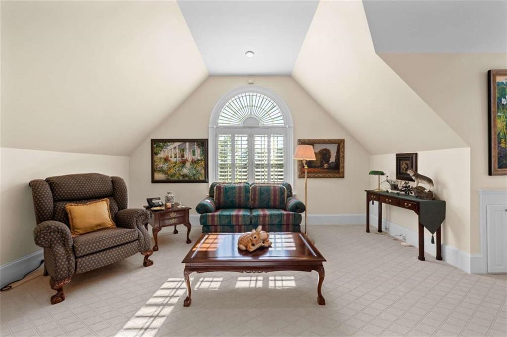 5225 Chalybeate Springs Road Woodland, GA 31836 - Photo 70 of 100 a living room with furniture a large window and a table
