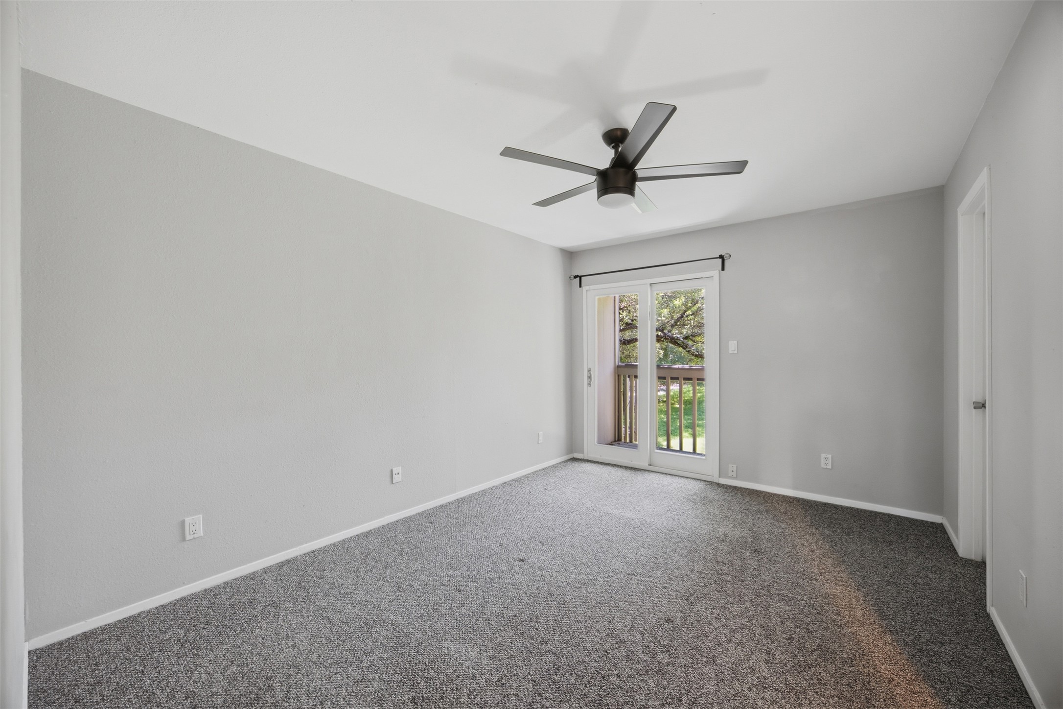 4204 Hudson Bend Road, Unit B Austin, TX 78734 - Photo 25 of 37 Room featuring grey textured carpeting and light grey walls