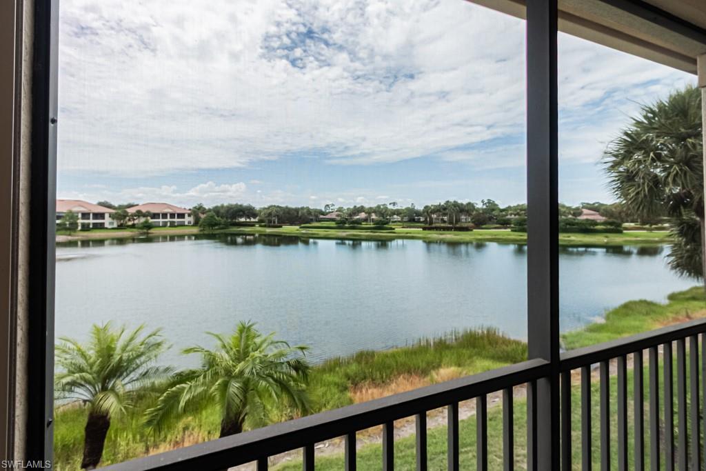 26448 Lucky Stone Road, Unit 202 Bonita Springs, FL 34135 - Photo 1 of 50 a view of a lake from a balcony