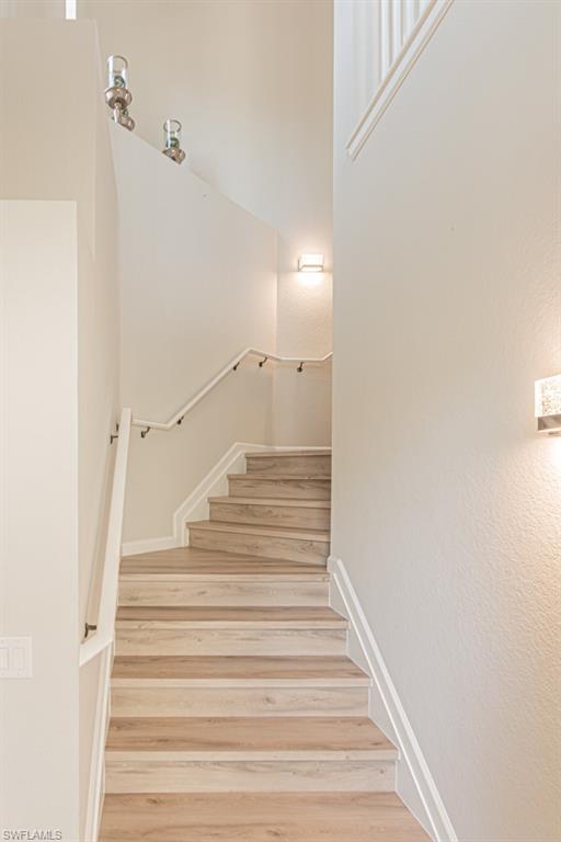 26448 Lucky Stone Road, Unit 202 Bonita Springs, FL 34135 - Photo 12 of 50 All new LVP flooring and new lighting welcomes you to your new home!