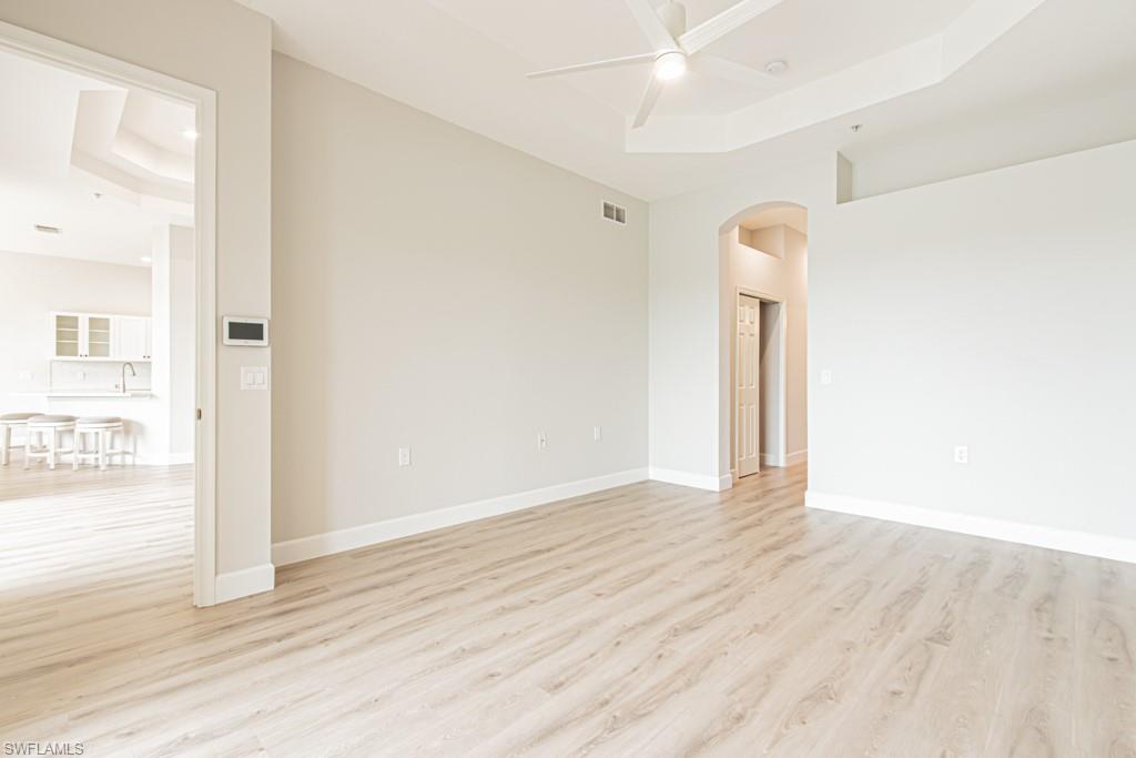 26448 Lucky Stone Road, Unit 202 Bonita Springs, FL 34135 - Photo 23 of 50 a view of an empty room with wooden floor