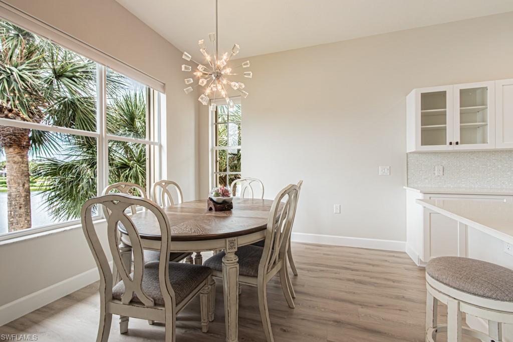 26448 Lucky Stone Road, Unit 202 Bonita Springs, FL 34135 - Photo 3 of 50 a view of a dining room with furniture window and outside view