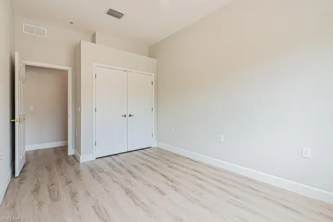 an empty room with wooden floor