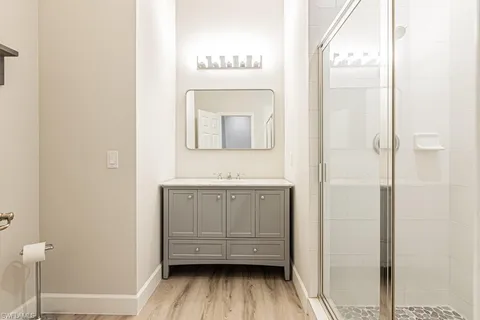 a bathroom with a sink a mirror and a toilet