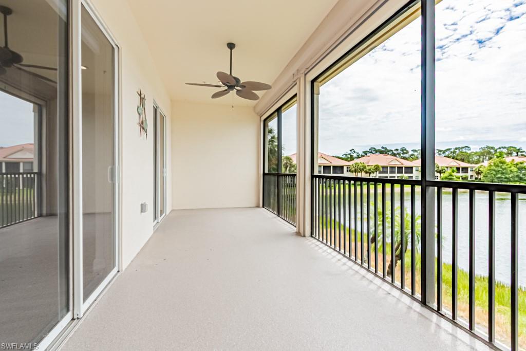 26448 Lucky Stone Road, Unit 202 Bonita Springs, FL 34135 - Photo 42 of 50 a view of a hallway with wooden floor and stairs
