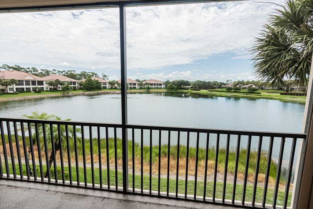 26448 Lucky Stone Road, Unit 202 Bonita Springs, FL 34135 - Photo 45 of 50 a view of a lake from a balcony