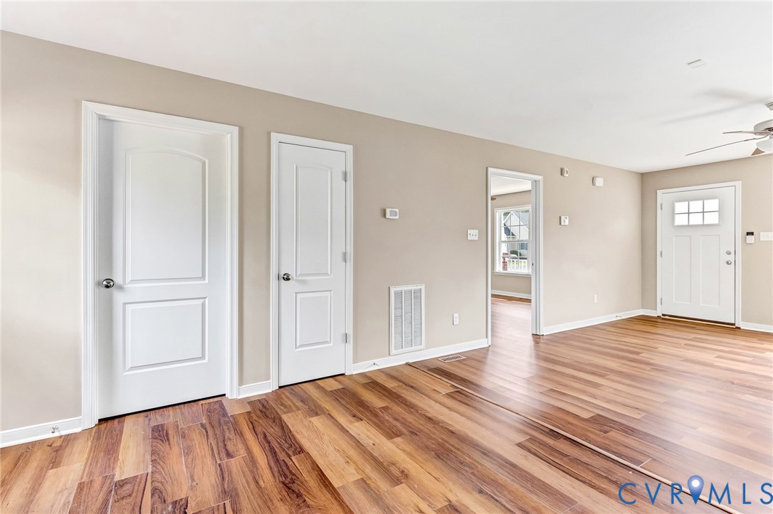 9925 Reymet Court Richmond, VA 23237 - Photo 7 of 30 a view of empty room with wooden floor