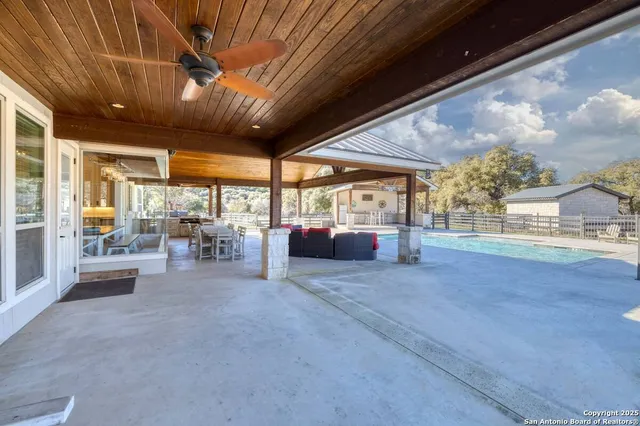 a view of living room with furniture and floor to ceiling window