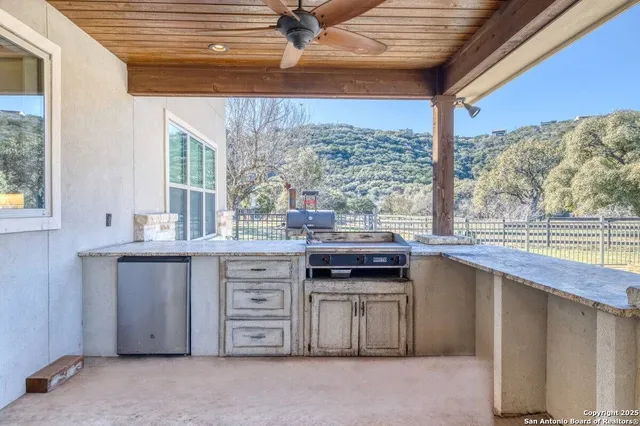 a kitchen with stainless steel appliances granite countertop a stove and a sink