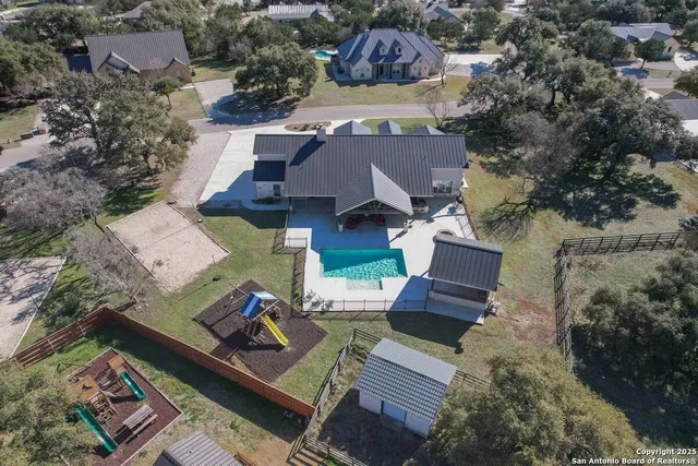 an aerial view of a house with a garden