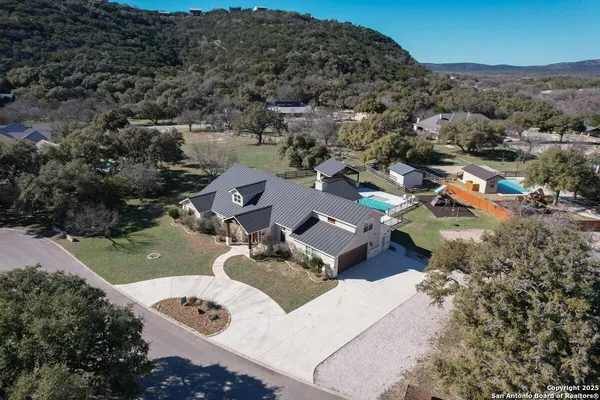an aerial view of a house with a garden