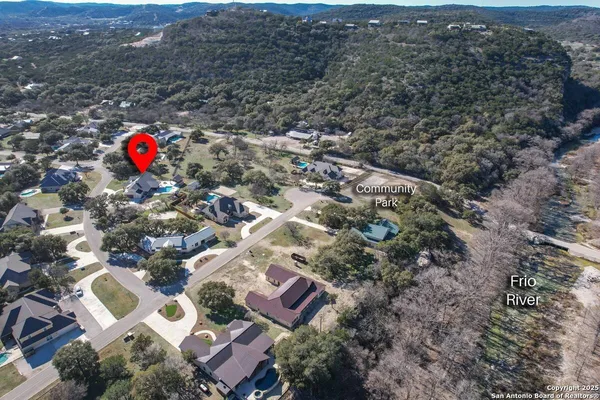 an aerial view of residential house with outdoor space