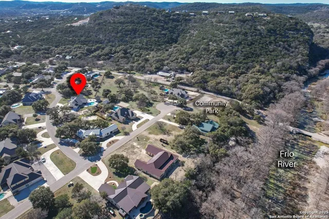 an aerial view of residential house with outdoor space