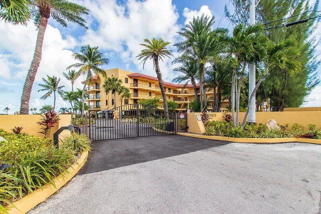 a view of a swimming pool with a lounge chair