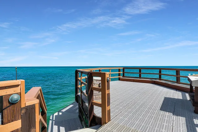 a view of a chairs and table on the wooden floor