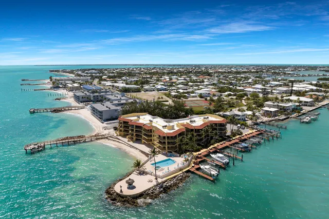 a view of a hallway with wooden floor and closet