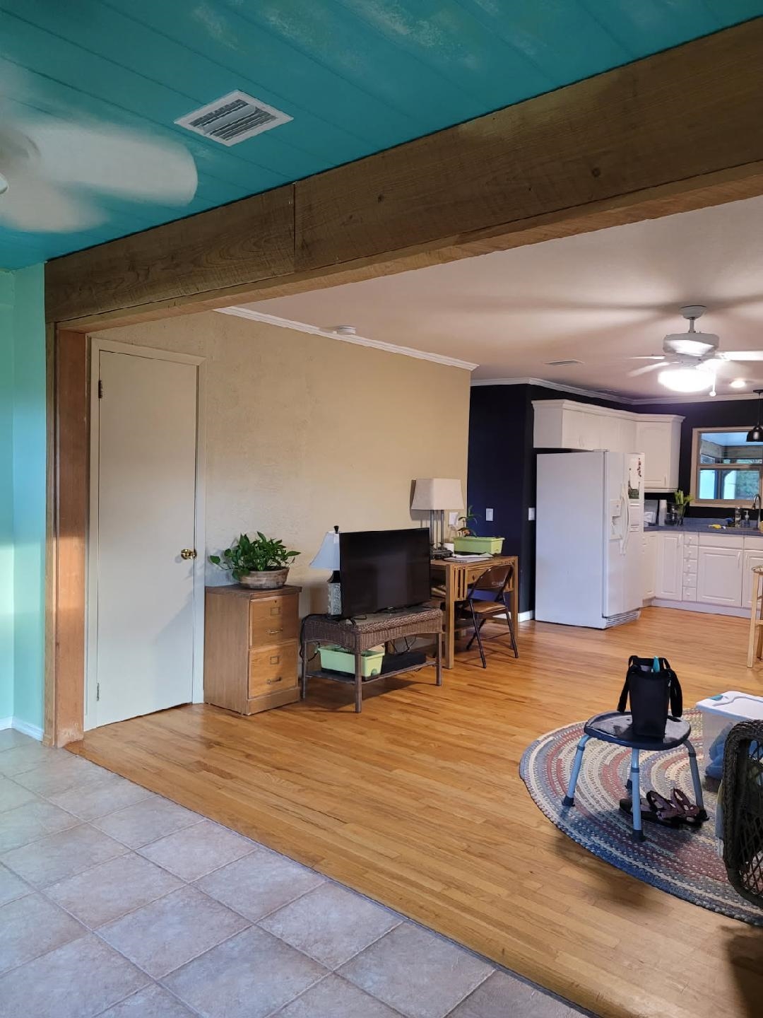 954-958 Grand Rondo Crescent City, FL 32112 - Photo 11 of 23 Living room featuring crown molding, ceiling fan, and light wood finished floors