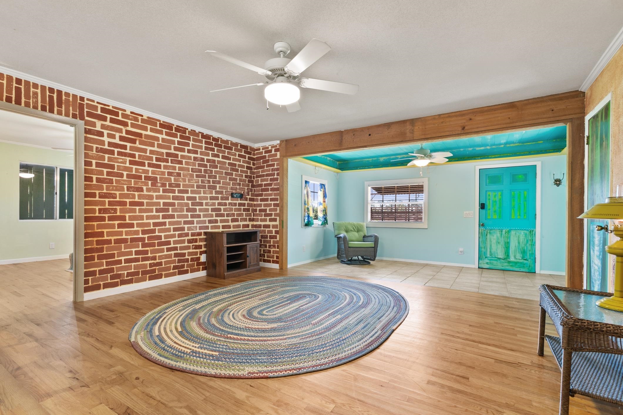 958-954 Grand Rondo Crescent City, FL 32112 - Photo 13 of 23 a view of a livingroom with wooden floor a ceiling fan and a window