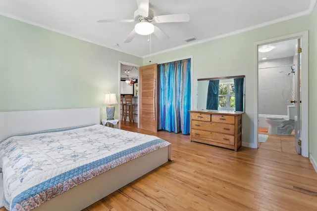 a bedroom with a bed and a dresser