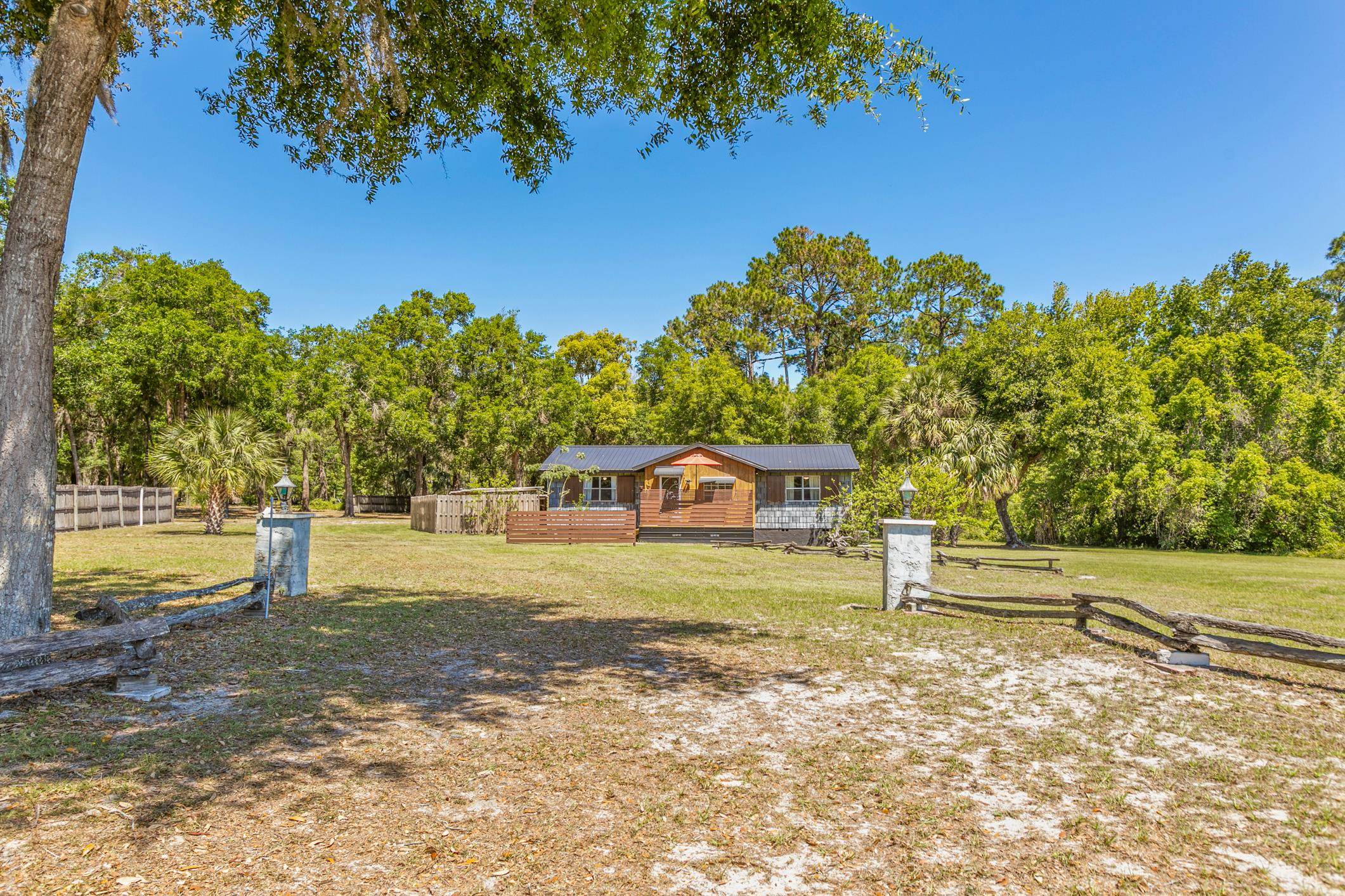 958-954 Grand Rondo Crescent City, FL 32112 - Photo 4 of 23 a front view of a house with a yard