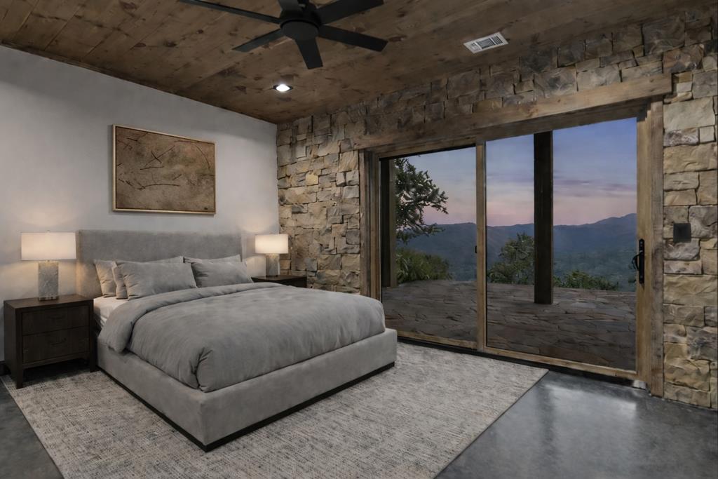 1 Riverview Circle Blue Ridge, GA 30513 - Photo 8 of 15 a spacious bedroom with a bed painting and a large window