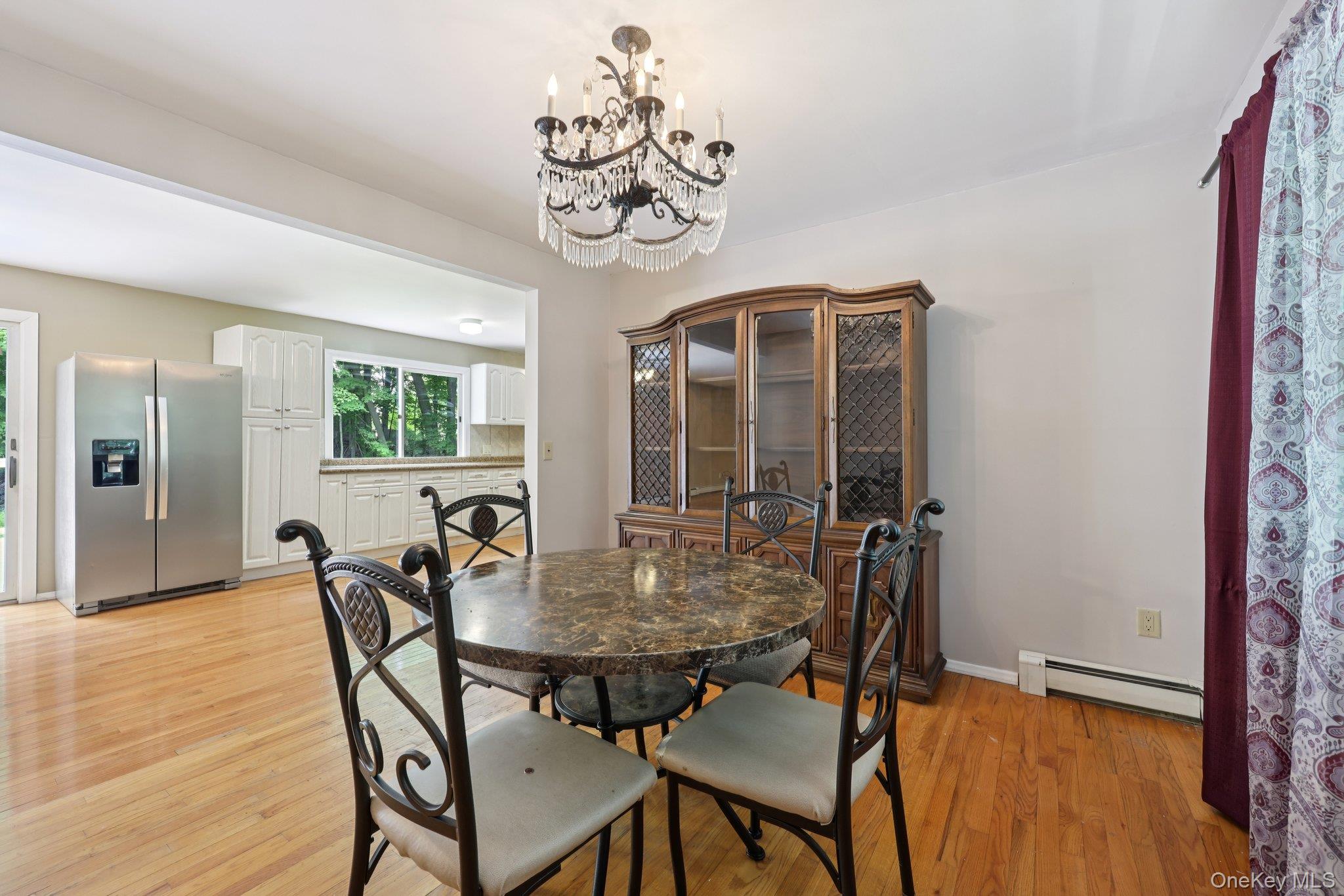 78 Pickerel Road Monroe, NY 10950 - Photo 11 of 37 a view of a dining room with furniture window and wooden floor