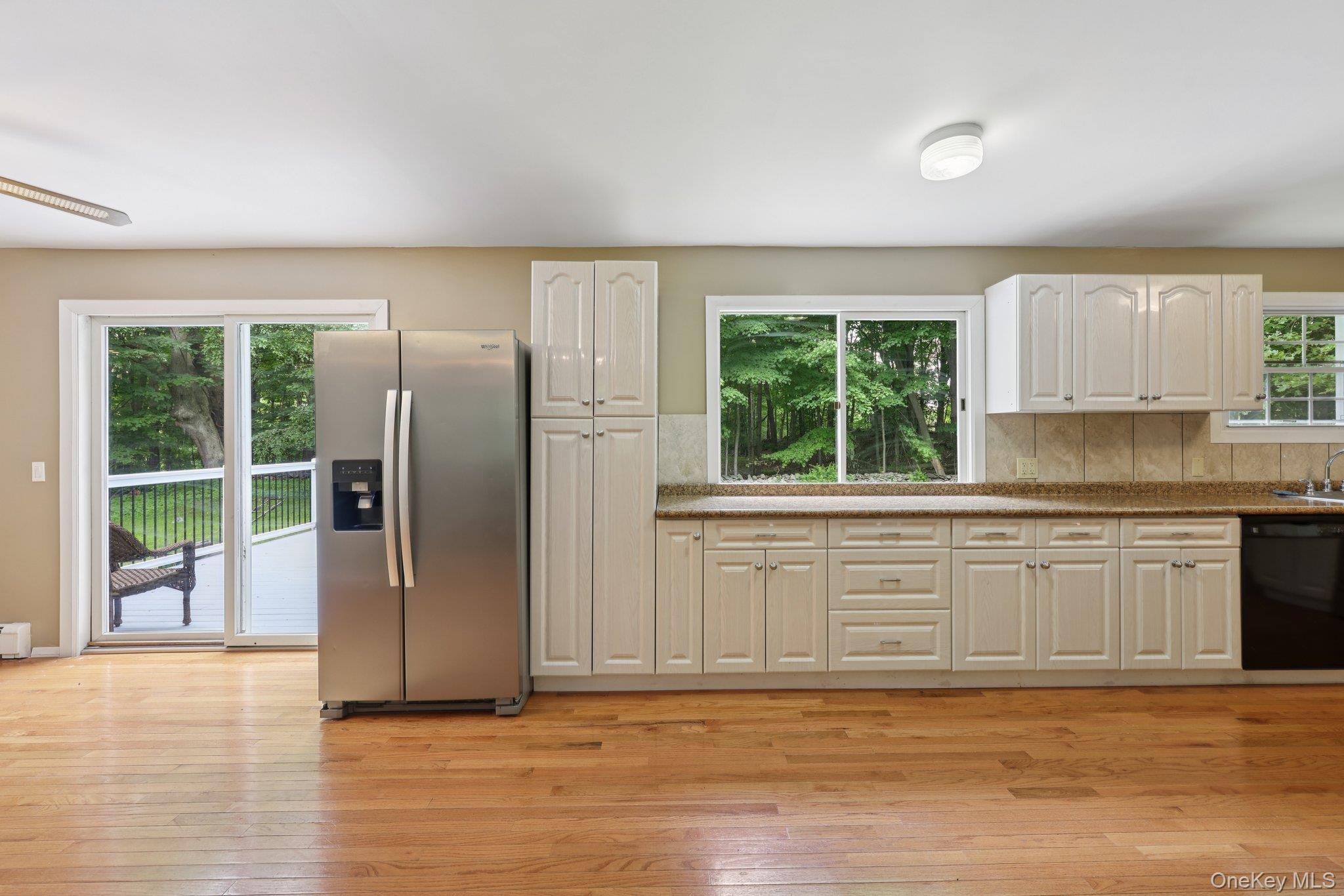 78 Pickerel Road Monroe, NY 10950 - Photo 15 of 37 a kitchen with stainless steel appliances granite countertop a refrigerator a sink and a large window
