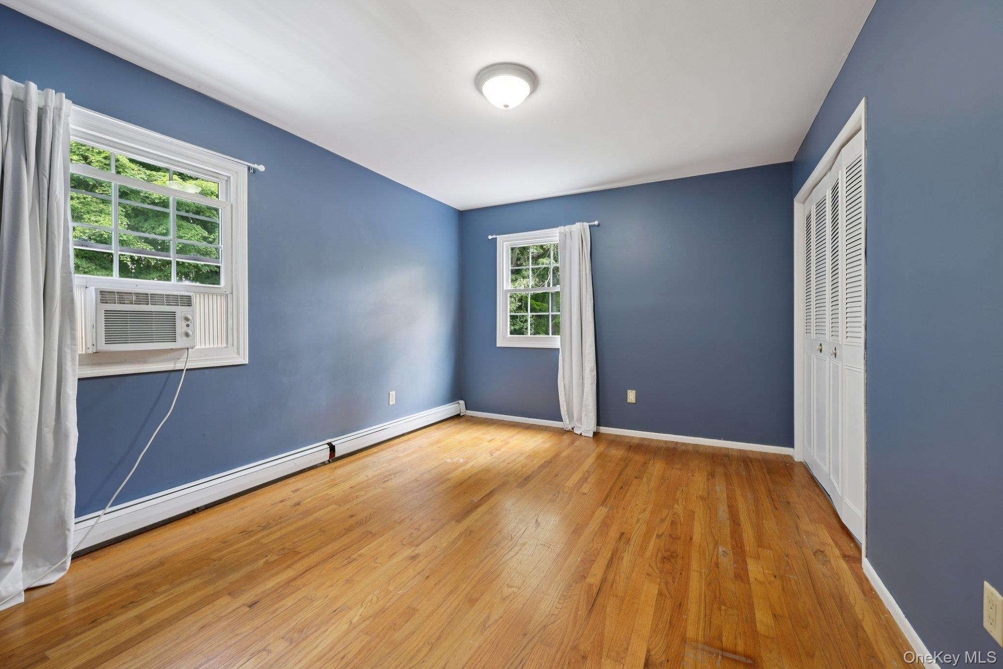78 Pickerel Road Monroe, NY 10950 - Photo 20 of 37 a view of an empty room with wooden floor and a window