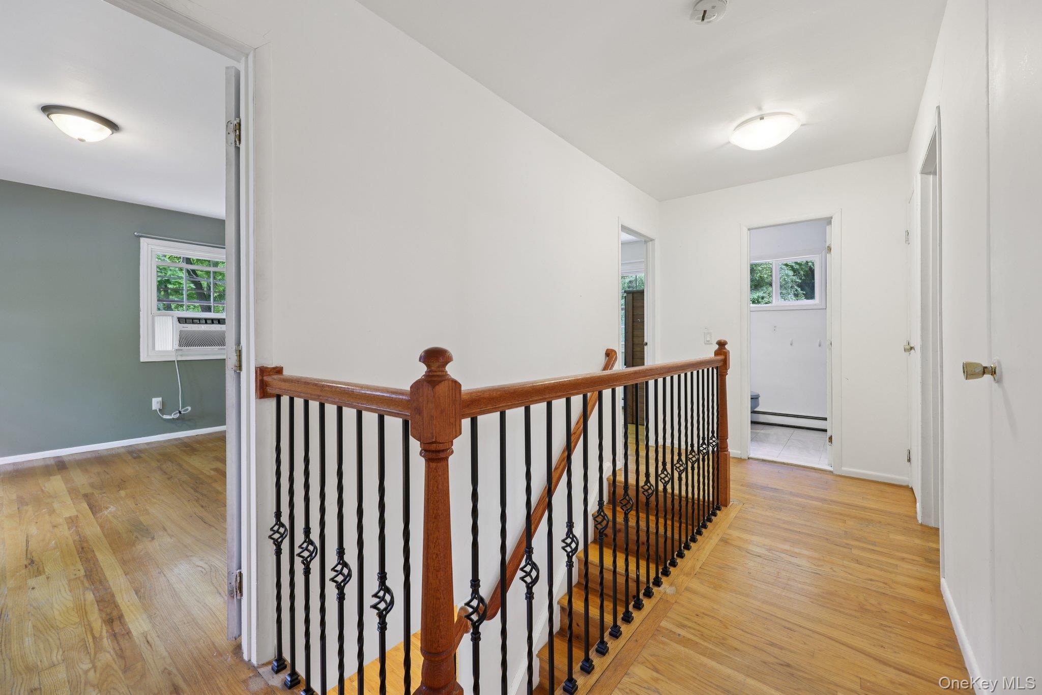 78 Pickerel Road Monroe, NY 10950 - Photo 22 of 37 a view of a hallway with wooden floor and stairs
