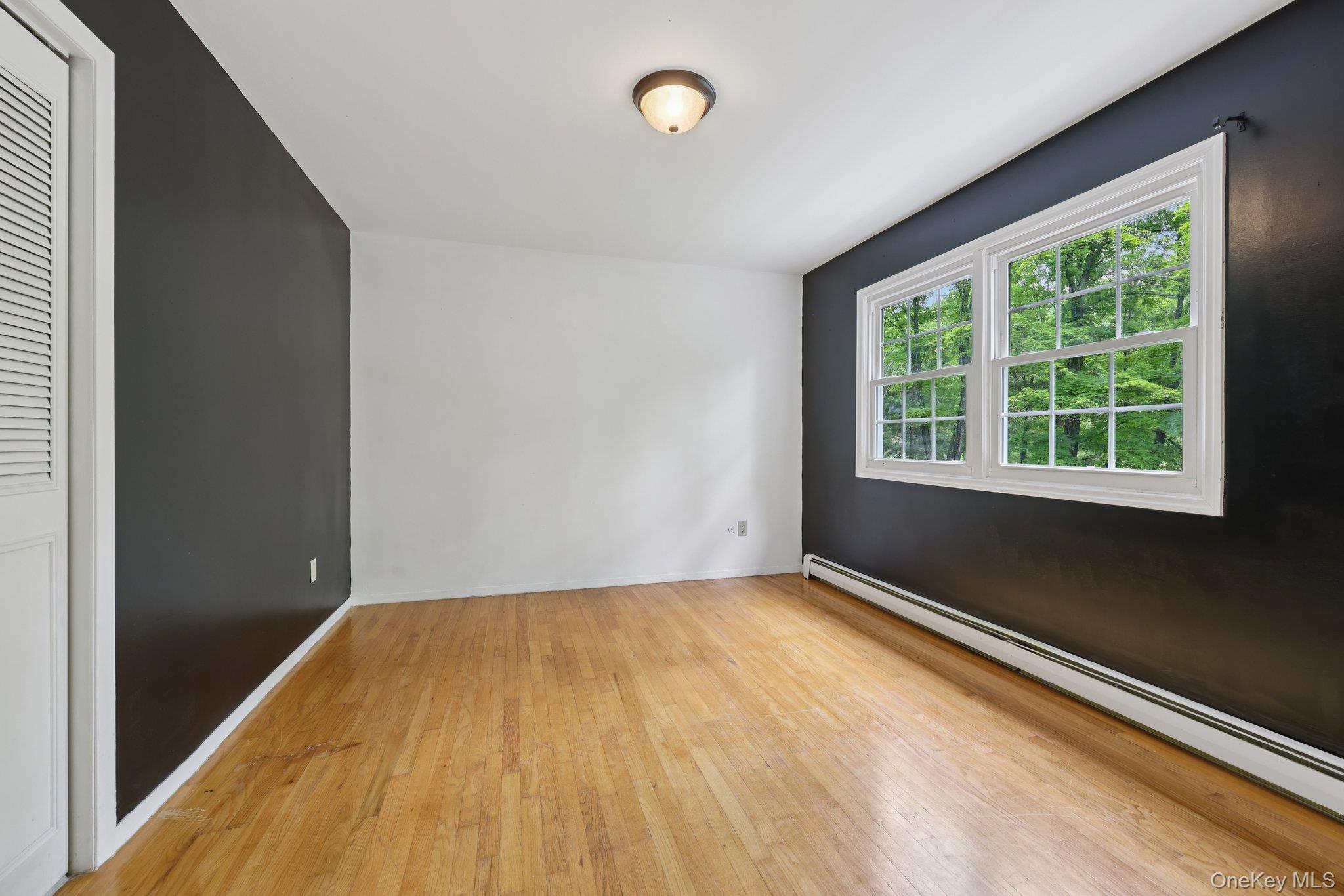 78 Pickerel Road Monroe, NY 10950 - Photo 23 of 37 a view of a room with wooden floor and windows