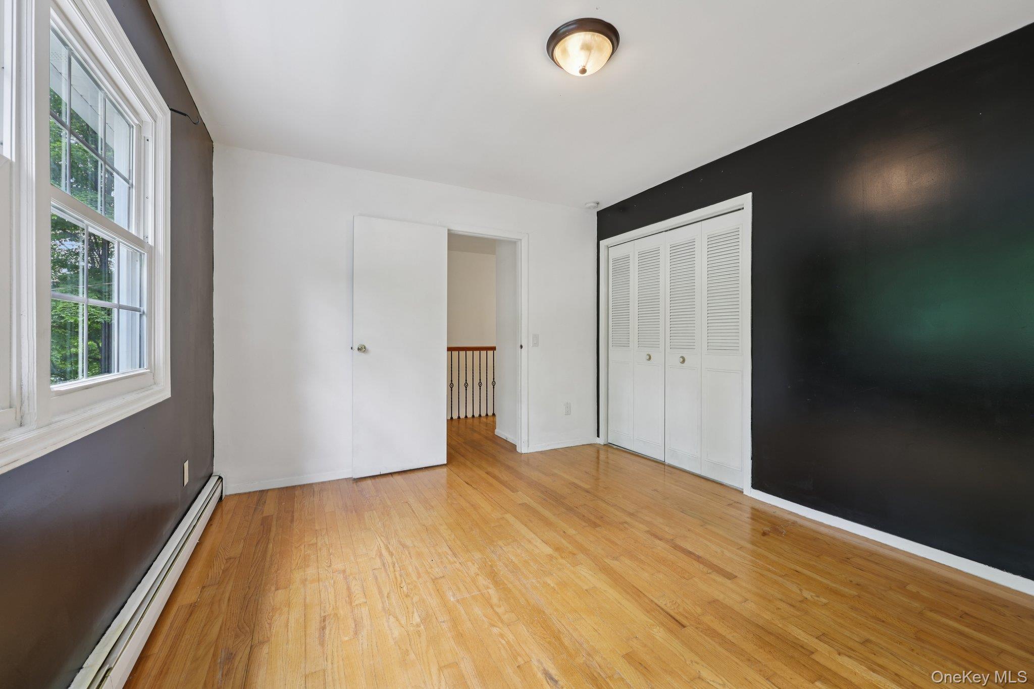 78 Pickerel Road Monroe, NY 10950 - Photo 24 of 37 a view of empty room with wooden floor and fan