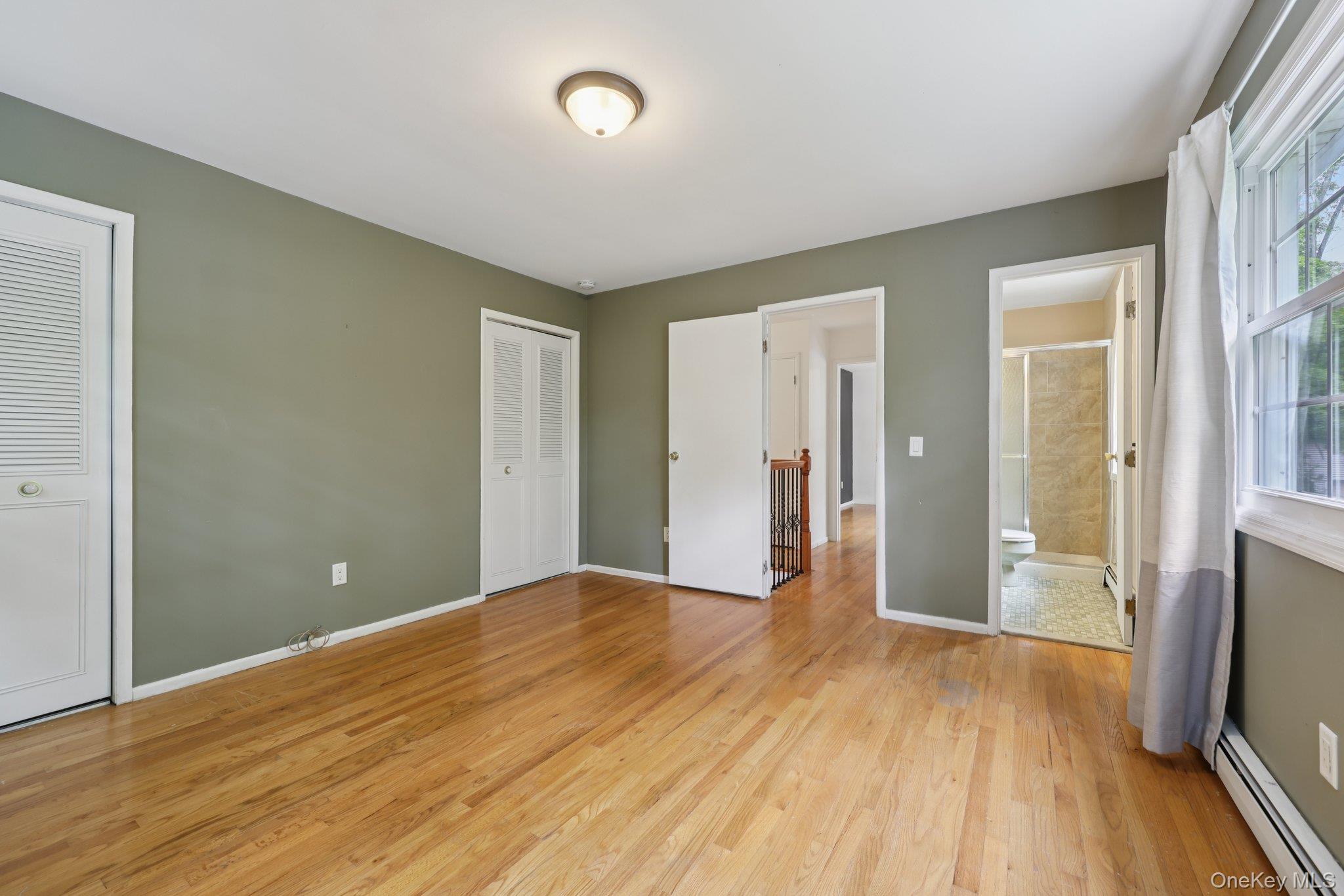 78 Pickerel Road Monroe, NY 10950 - Photo 25 of 37 a view of empty room with wooden floor and fan